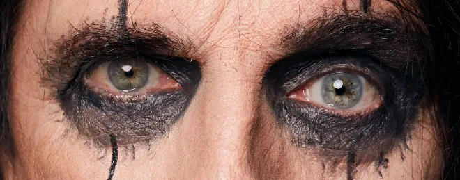 Close-up of eyes with smudged dark makeup